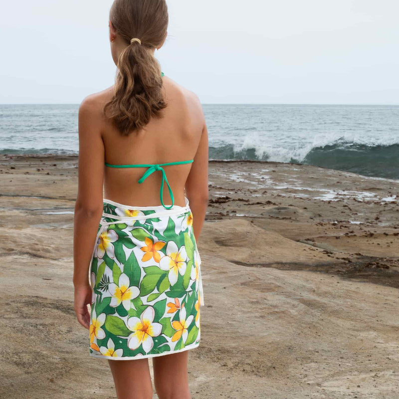 girl wearing towel wrap skirt with flower on it