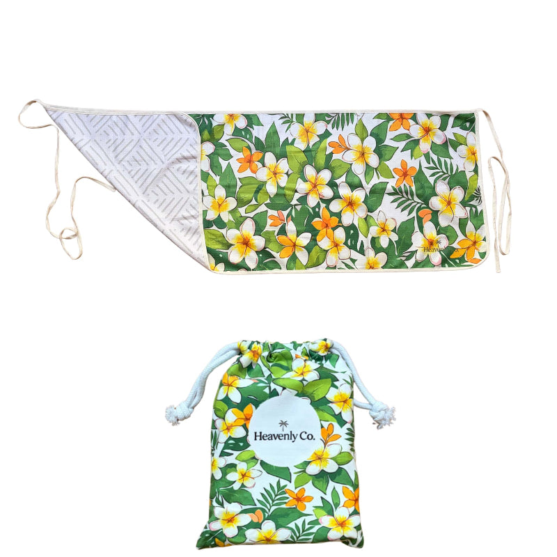 Floral-patterned drawstring bag with a matching towel on a white background