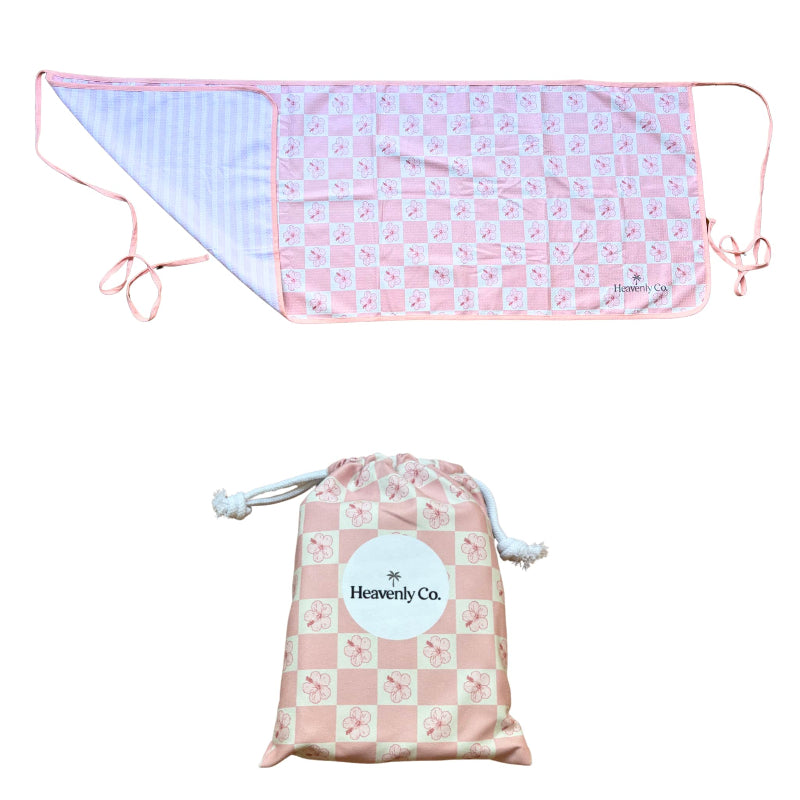 Pink and white checkered wrap skirt with drawstring and matching storage bag on a white background