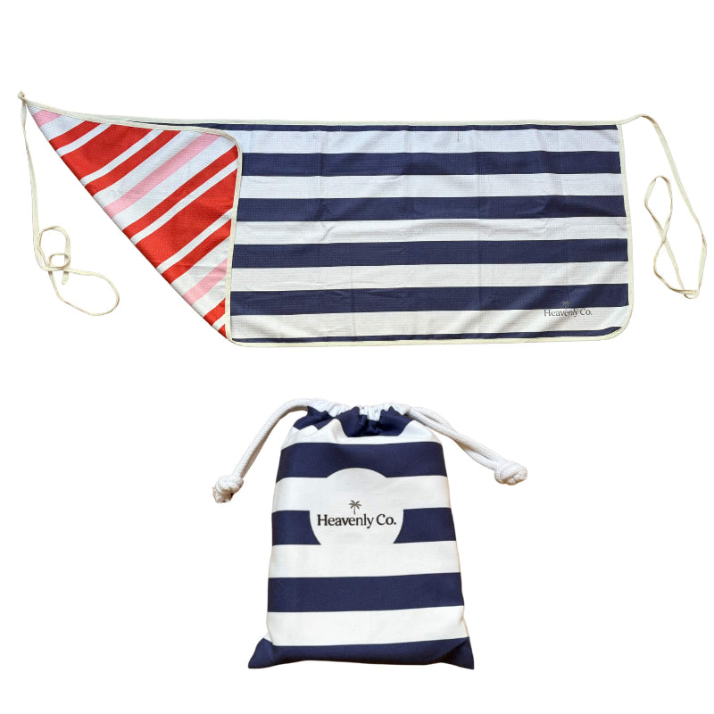 Navy and white striped bag with red and white patterned flap on a white background